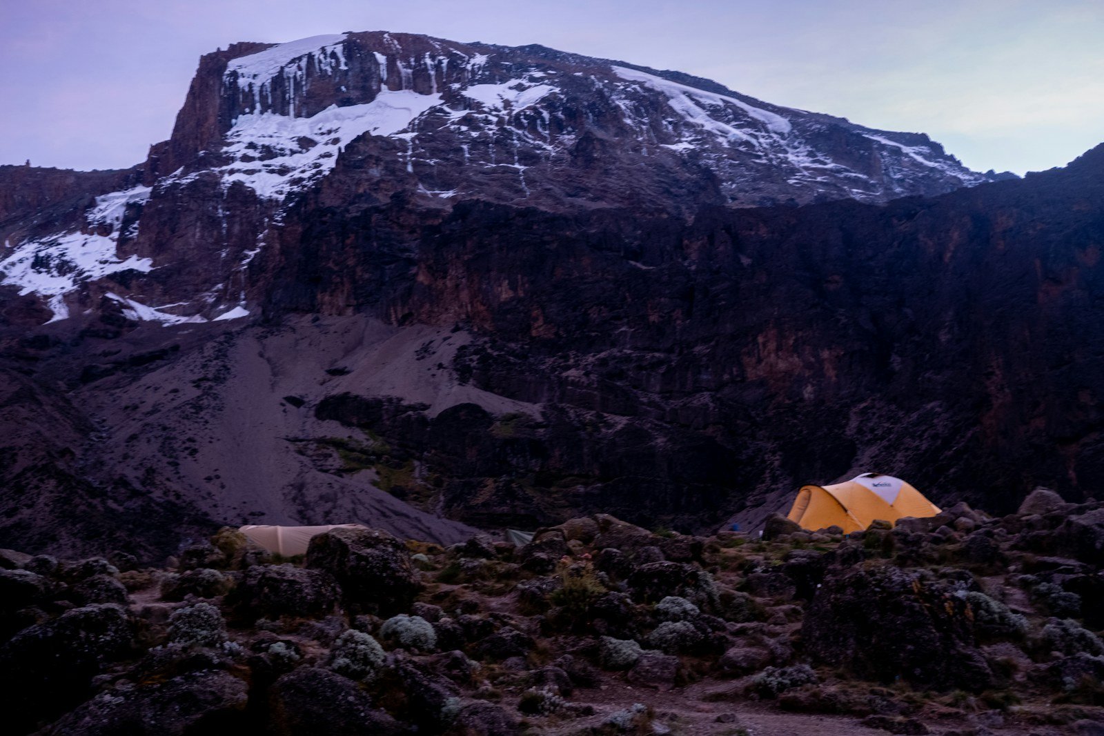 Tent beneath Kilimanjaro’s rocky upper slopes — Umbwe Route illustration