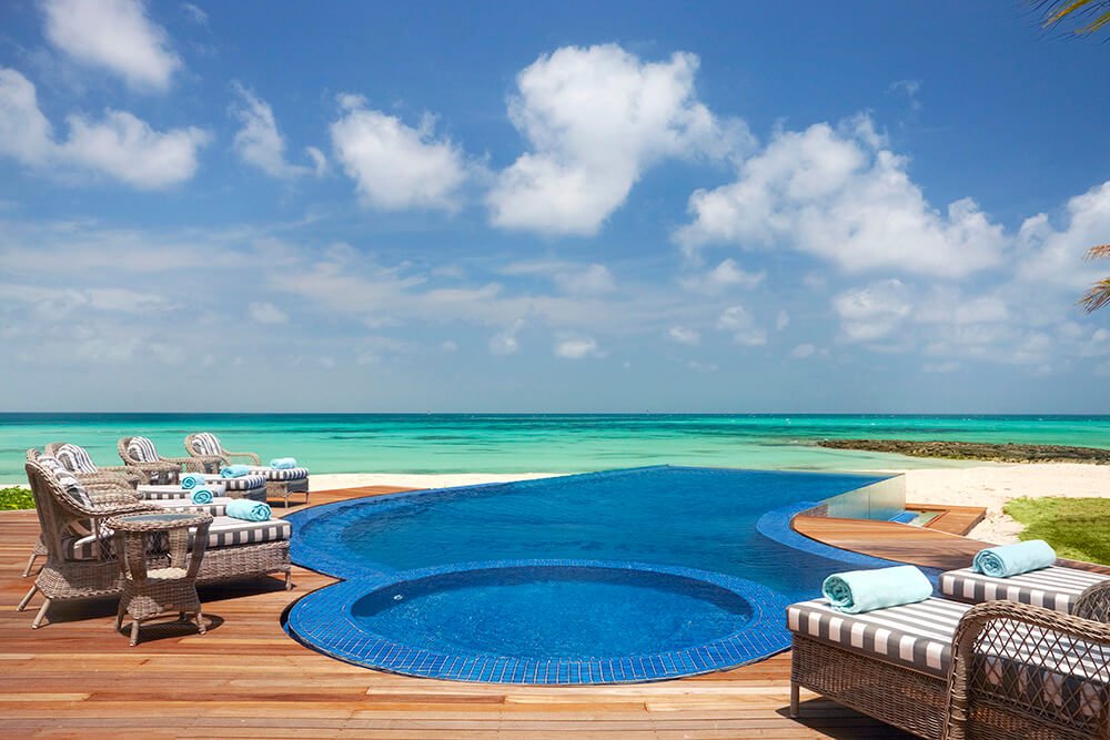 Swimming pool beside the oceanfront villa at Thanda Private Island