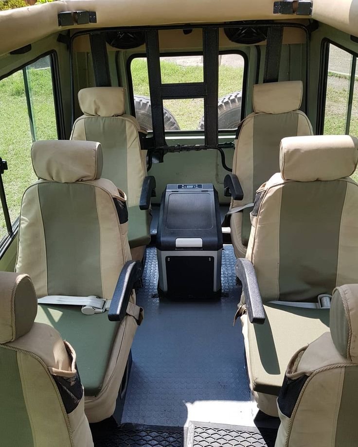 Passenger seating and aisle inside a safari vehicle