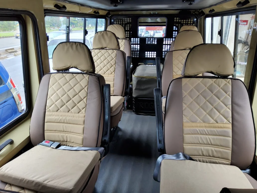 Safari vehicle seats beneath an open viewing roof