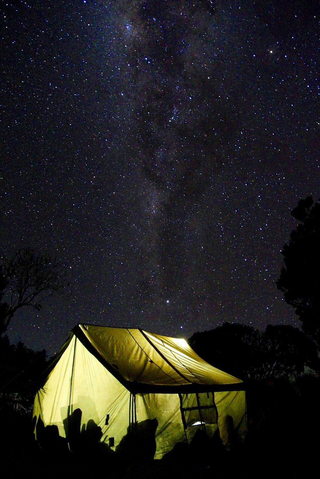 Illuminated tent beneath the Milky Way — Kilimanjaro camping illustration