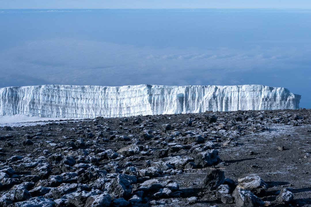 Glacier above rocky summit terrain — six-day Rongai climbing illustration