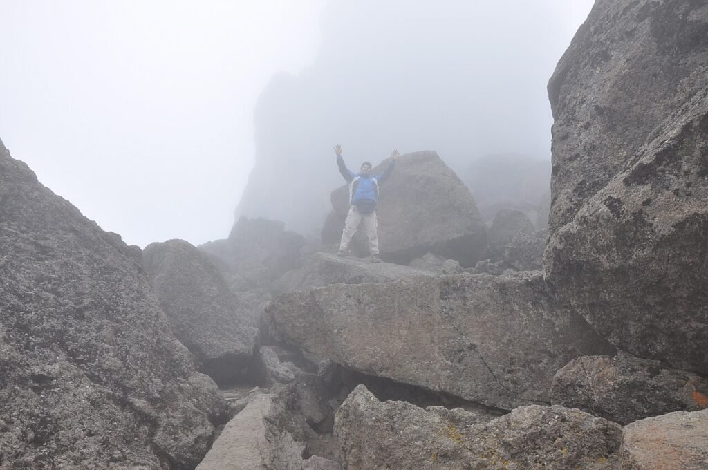 Trekkers pausing together at a high acclimatisation point on Kilimanjaro